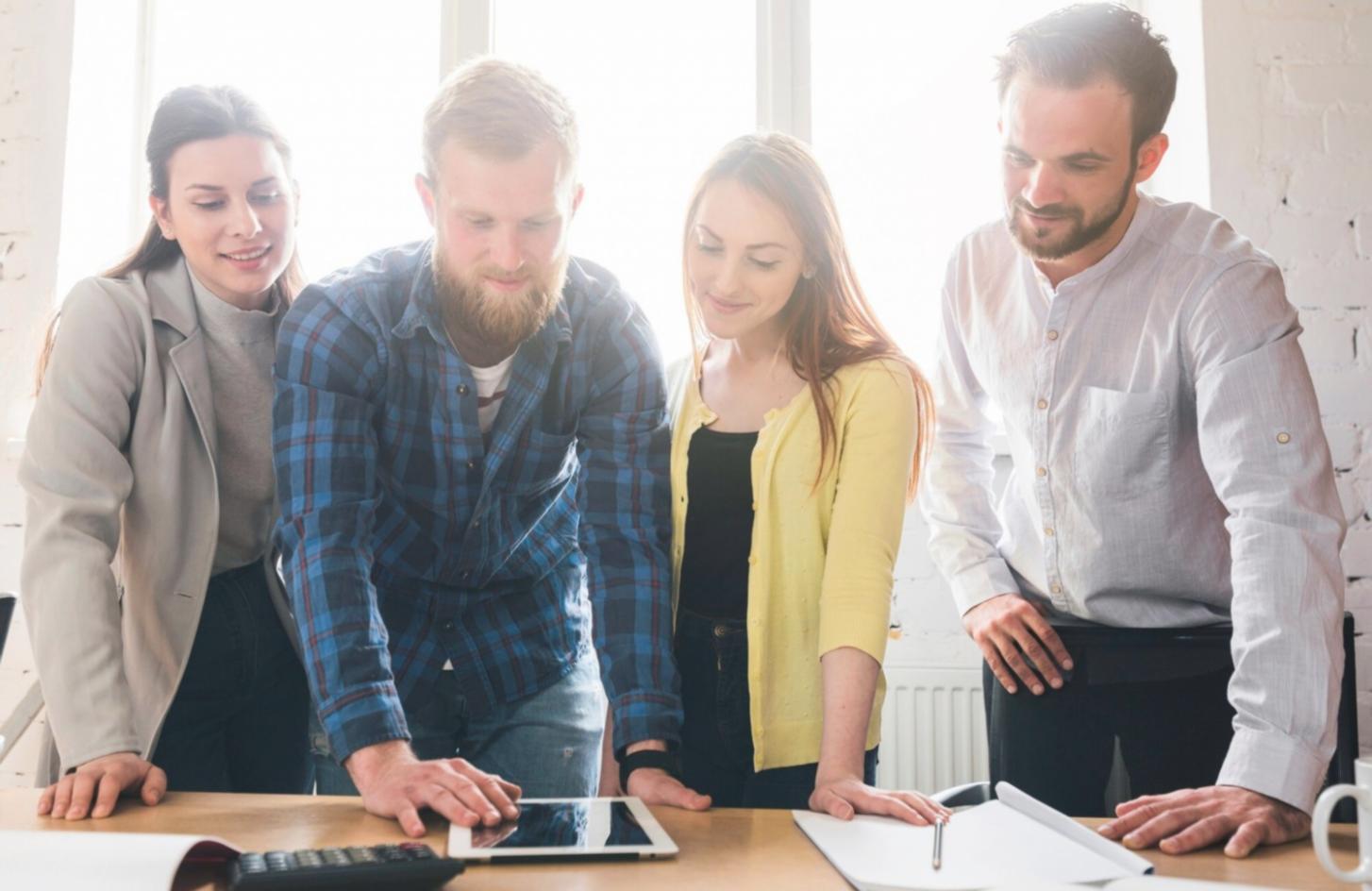 Budget planning workspace with financial documents and calculator in natural lighting